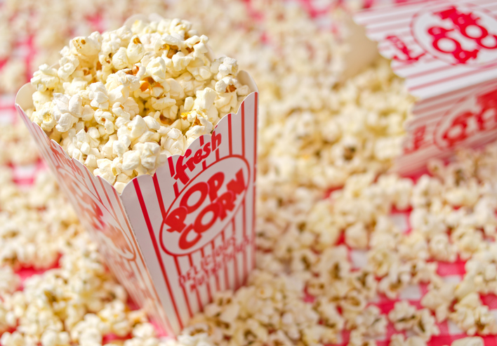 Top 10 Foods To Avoid This Winter A box of freshly popped popcorn.