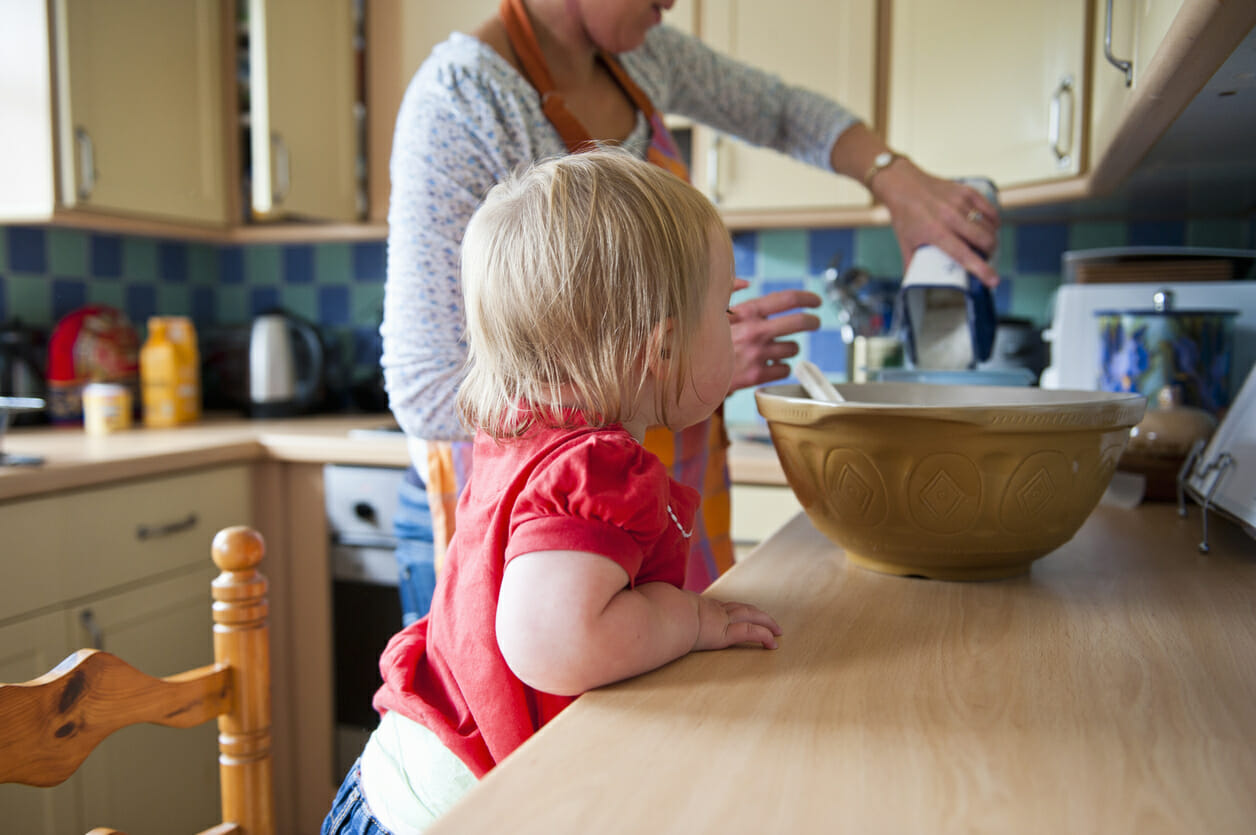 Toddler girl baking with mother