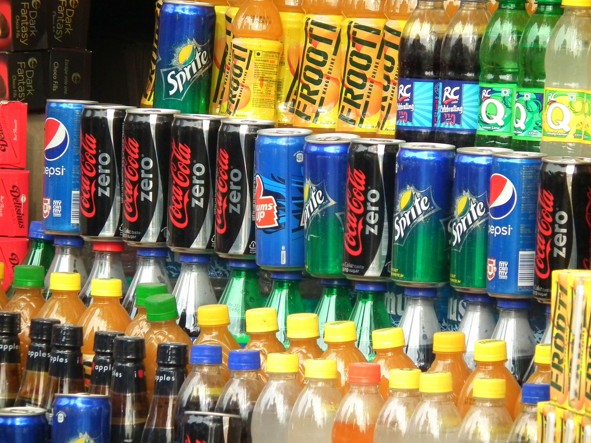 Kolkata, India - April 20, 2016: Branded Refreshment Drinks such as "Frooti", "Pepsi", "Sprite", "Coca Cola", etc stacked and kept for sale at a retail shop in Kolkata
