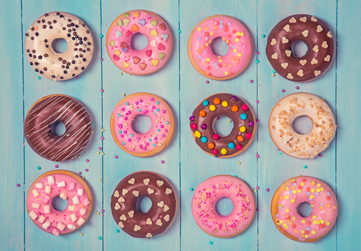 Donuts on a pastel blue wooden background