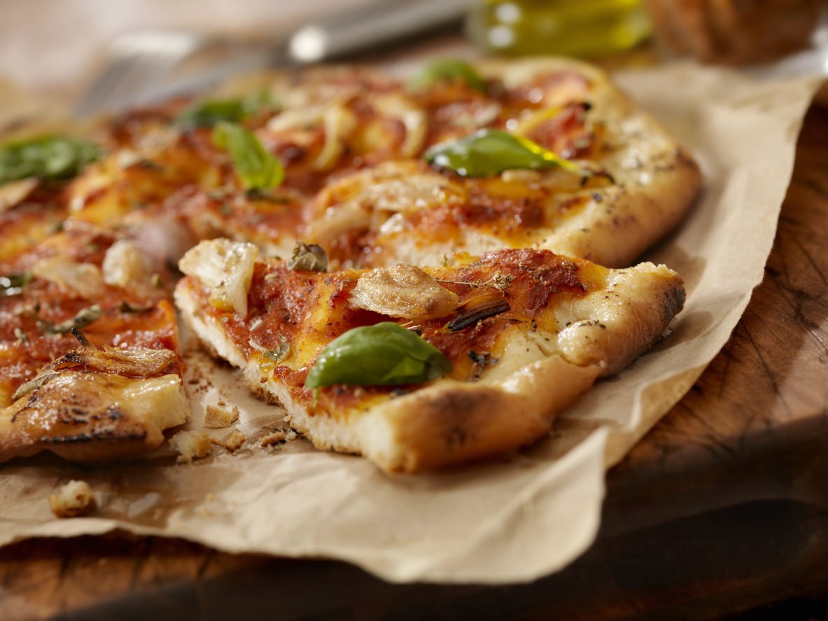 Authentic Italian, Hand Made Marinara Pizza with Roasted Garlic, Marinara Sauce, Fresh Basil and Olive Oil- Photographed on a Hasselblad H3D11-39 megapixel Camera System