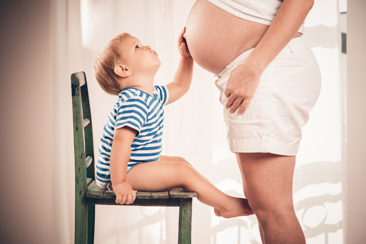 Expectant mother and child , Pregnant woman and her son await the birth of her baby